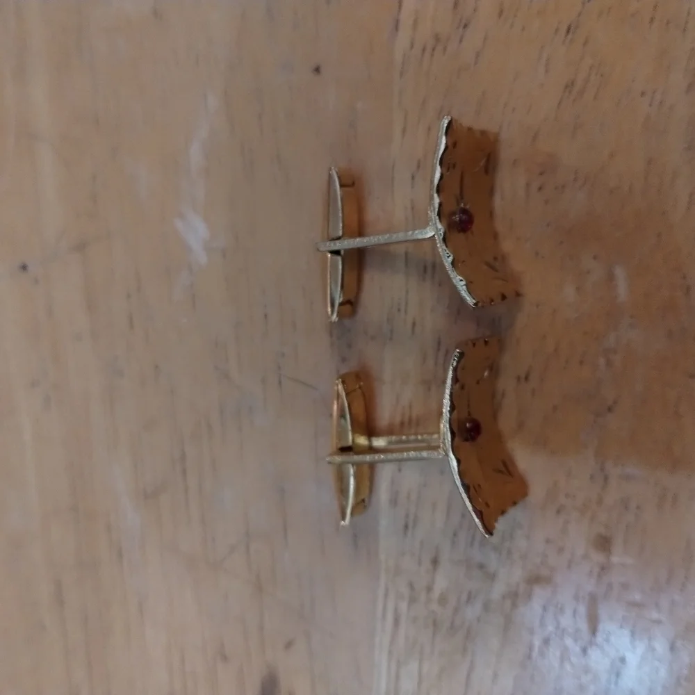 Men's unsigned cuff links with red stone